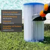 A pool filter is being cleaned with a hose attachment, set against a backdrop of a pool and grass. Produktbild-Vorschau