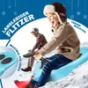 Two children are sledding down a snowy hill on blue sleds. Produktbild-Vorschau