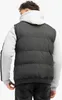 A person wearing a black puffer vest over a grey hoodie, viewed from the back. Anteprima dell’immagine prodotto