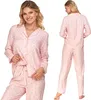 A woman is shown wearing a pink pajama set with a polka dot pattern. The image is a composite of two views: a front view and a back view. Produktbild-Vorschau