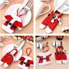 A collage of four images showing Christmas-themed cutlery holders shaped like Santa's suit. Produktbild-Vorschau