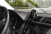 A black wireless car charger mounted on a car dashboard. Produktbild-Vorschau