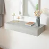 A floating shelf with decorative items on it, in front of a mirror. Náhľad obrázku produktu