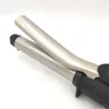 A close-up shot of a curling iron on a white background. Produktbild-Vorschau