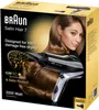 The image shows the packaging of a Braun Satin Hair 7 hair dryer, featuring a model and the product itself. Produktbild-Vorschau
