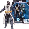 A product shot of a Batman action figure in its packaging, with the figure also displayed outside the box. Podgląd zdjęcia produktu