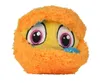 A close-up of a fluffy orange toy monster with large eyes. Produktbild-Vorschau