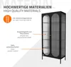 A black display cabinet with glass doors is shown, with text overlays describing its materials and included accessories. Náhľad obrázku produktu