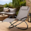 A relaxing outdoor patio scene with a lounge chair and sofa. Produktbild-Vorschau