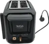 A black and gray Tefal Includeo toaster with a power cord. Voir les images du produit