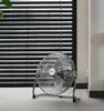 A floor fan is placed on a carpeted floor in front of black horizontal blinds. Náhľad obrázku produktu
