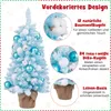 A decorated mini Christmas tree with text overlays describing its features. Podgląd zdjęcia produktu