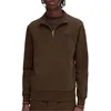 A man wearing a brown half-zip pullover. Produktbild-Vorschau