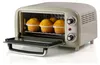 A retro-style toaster oven with four muffins inside. Náhled obrázku produktu