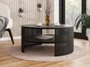 A modern living room scene featuring a black round coffee table with a slatted design and a lower shelf, placed on a light-colored rug. Náhľad obrázku produktu