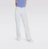 A person wearing white jeans and a blue top, standing against a plain background. Produktbild-Vorschau