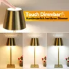 A collage showing a touch-dimmable LED table lamp in gold, with demonstrations of different color temperatures. Anteprima dell’immagine prodotto