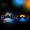 Two remote-controlled monster trucks are shown from the rear, with colorful lighting effects around them. Voir les images du produit
