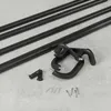 A set of black metal curtain rods and mounting hardware laid out on a light gray surface. Podgląd zdjęcia produktu
