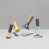 Four colorful kitchen tools with wooden handles are arranged on a white surface against a gray background. Podgląd zdjęcia produktu