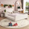 A child's bedroom decorated for Christmas, featuring a white bed with a desk and chair. Voir les images du produit