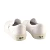 A pair of white Vans slip-on shoes shown from the back against a white background. Produktbild-Vorschau