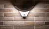 A modern LED outdoor wall light with a motion sensor is mounted on a brick wall. Produktbild-Vorschau