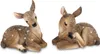 Two fawn figurines covered in artificial snow, lying down. Produktbild-Vorschau