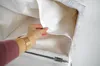A hand is shown holding the inner lining of a laundry basket. Podgląd zdjęcia produktu