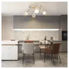 A modern kitchen and dining area with a ceiling light fixture. Produktbild-Vorschau