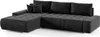 A dark gray sectional sofa with tufted cushions and throw pillows, shown from a side-angle on a white background. Náhled obrázku produktu