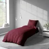 A bedroom scene with a bed, window, and lamp. Produktbild-Vorschau