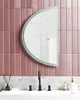 A bathroom sink area with a mirror above it. Náhľad obrázku produktu