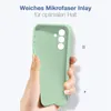 A hand holding a light green phone case against a white background. Produktbild-Vorschau