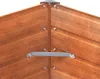 Close-up view of the corner of a wooden raised garden bed, showing metal corner brackets and screws. Produktbild-Vorschau