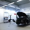 A car repair shop with a car being worked on. Produktbild-Vorschau