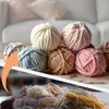 A collage showing balls of yarn in various pastel colors on a table, with a second image showing a pile of loose yarn. Produktbild-Vorschau