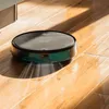 A robotic vacuum cleaner is shown cleaning a wooden floor, with light casting shadows. Náhled obrázku produktu
