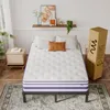 A mattress is set up on a bed frame in a room, with a nightstand and a shelf with decor. Produktbild-Vorschau