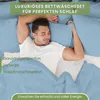 A man sleeping comfortably in bed with blue bedding. Produktbild-Vorschau