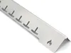 A close-up, angled view of a stainless steel grill heat shield with T-shaped cutouts and a flame logo. Produktbild-Vorschau