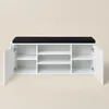 A white shoe cabinet with a black seat on top, shown from the front with one door open. Náhľad obrázku produktu