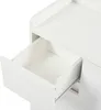 A close-up view of an open drawer on a white cabinet. Produktbild-Vorschau