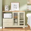 A kitchen or dining room sideboard with a microwave, coffee maker, and artwork on top. Voir les images du produit