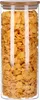 A clear, front-facing shot of a tall, cylindrical glass jar filled with corn flakes, topped with a bamboo lid. Produktbild-Vorschau