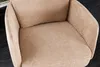 A close-up view of a beige upholstered chair. Produktbild-Vorschau