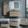 A bathroom vanity set with a sink and cabinet, shown from multiple angles. Voir les images du produit