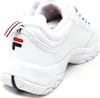 A close-up side view of a white Fila sneaker. Anteprima dell’immagine prodotto
