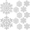 A collection of silver glitter snowflake ornaments on a white background. Náhled obrázku produktu