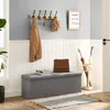 An entryway scene featuring a storage bench, coat rack, and umbrella stand. Náhled obrázku produktu